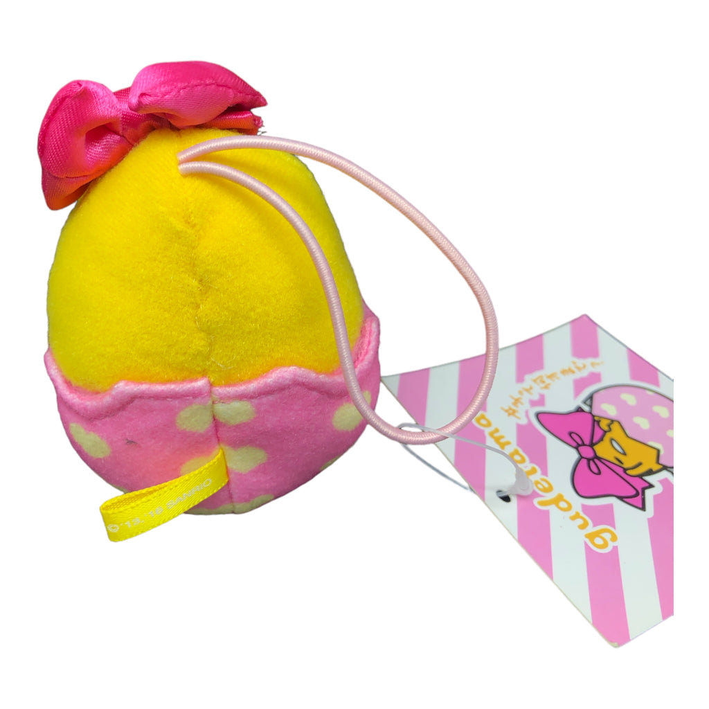 Back view of Sanrio Gudetama Mascot Hair Band, highlighting the pink and yellow colors with a cute bow accent
