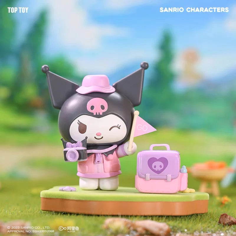 Sanrio Kuromi blind box with Kuromi holding a flag and camera and her backpack is next her