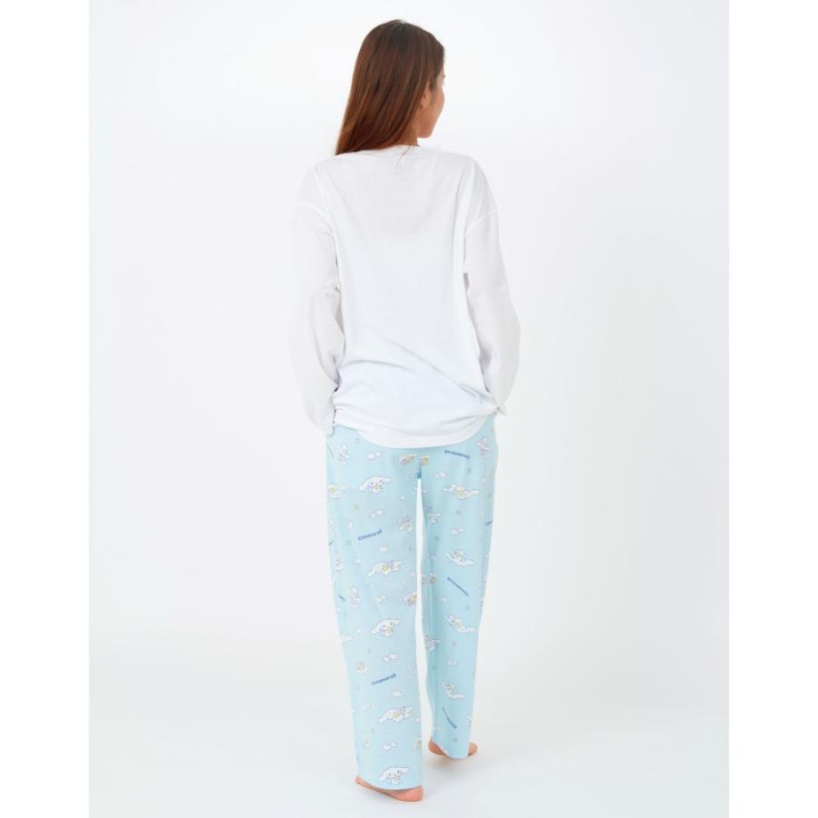 Back view of a woman in a Cinnamoroll pajama set, emphasizing the cozy and loose-fitting design.
