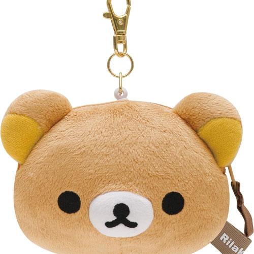 A soft, cuddly San-X Rilakkuma plushie pass case with golden reel clip, showcasing Rilakkuma's cute face and tiny ears, ideal for storing cards and passes.