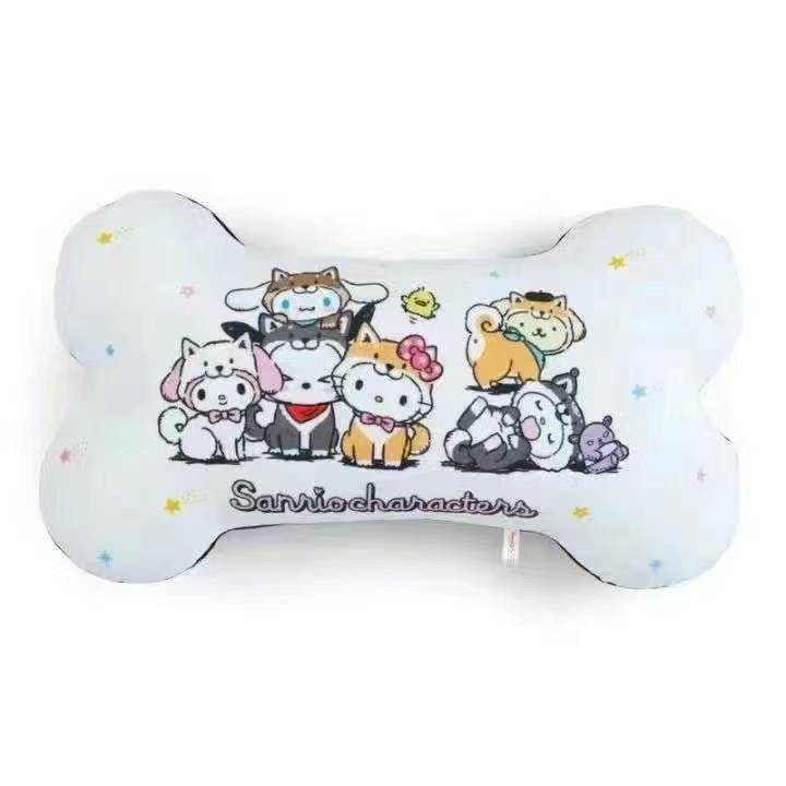 Front view of a Sanrio characters bone-shaped neck pillow with colorful illustrations of popular Sanrio mascots on a white background with stars