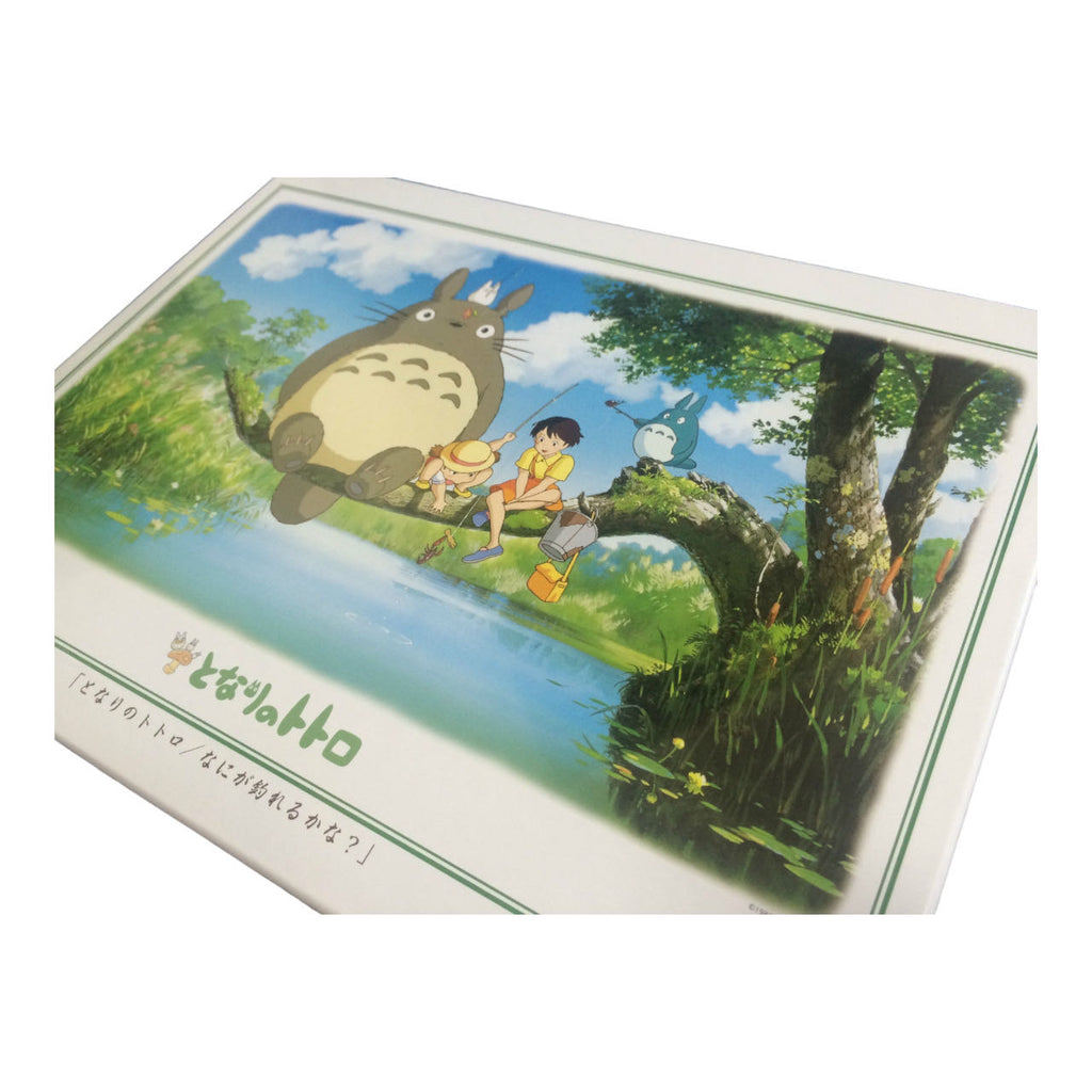 Packaging of a 1000-piece Totoro puzzle box, showcasing the famous fishing scene for a nostalgic puzzle-building experience