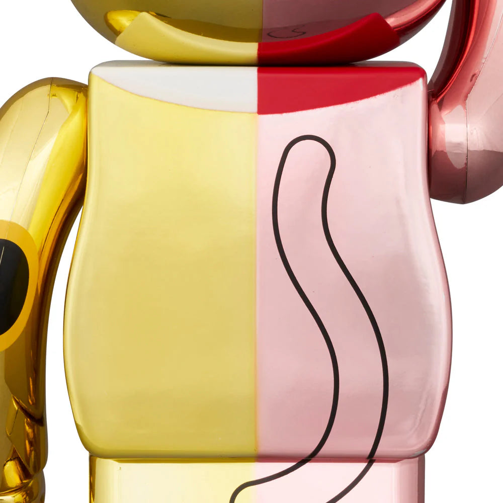 Back detail of BE@RBRICK Manekineko showing pink and gold plating with a stylized cat tail graphic.