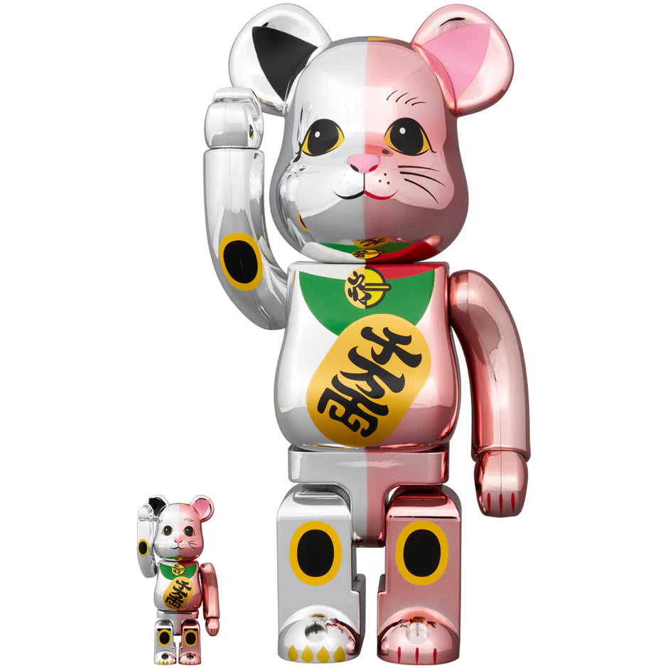 BEARBRICK Manekineko Peach and Silver Plated 100% & 400% figures with a waving arm, featuring a glossy pink and silver finish.