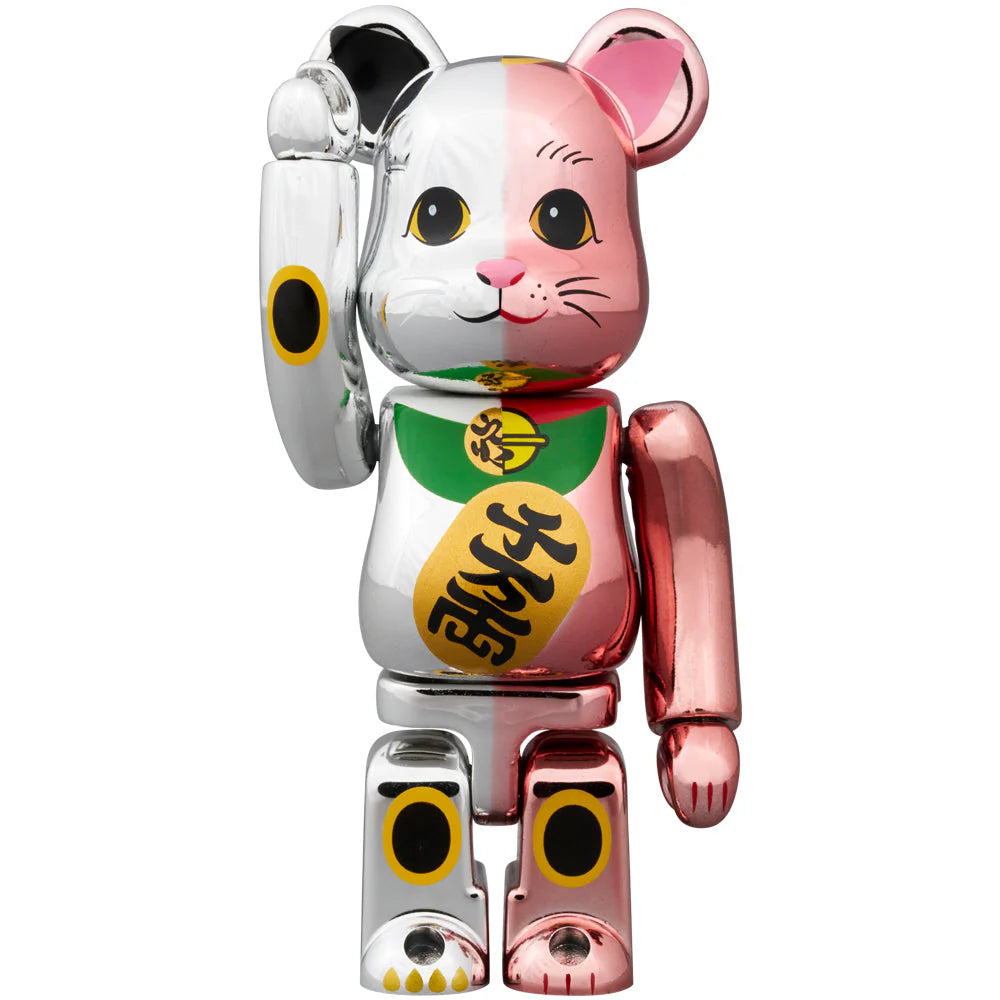 Close-up of the smaller BEARBRICK Manekineko figure in pink and silver plating, showcasing detailed facial features.