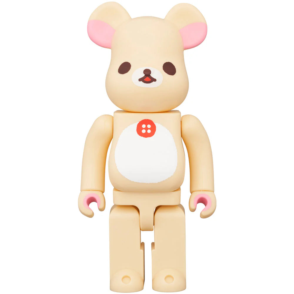 Front view of Bearbrick 400% Korilakkuma in a standing pose, featuring a light cream body with a distinctive white belly patch and pink accents on the ears