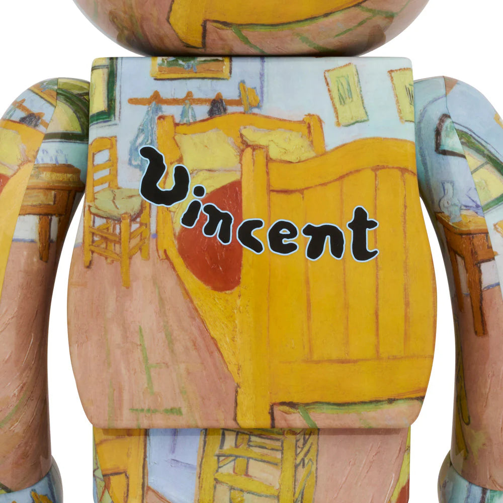 Close-up of the Bearbrick 400% Van Gogh "The Bedroom" figure, highlighting the "Vincent" signature on the back, with intricate details from Van Gogh's painting.