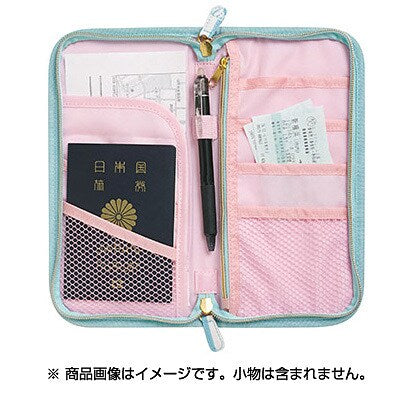 Interior of Rilakkuma passport case showing card slots, pen holder, and pockets with a sample passport and tickets for illustration purposes
