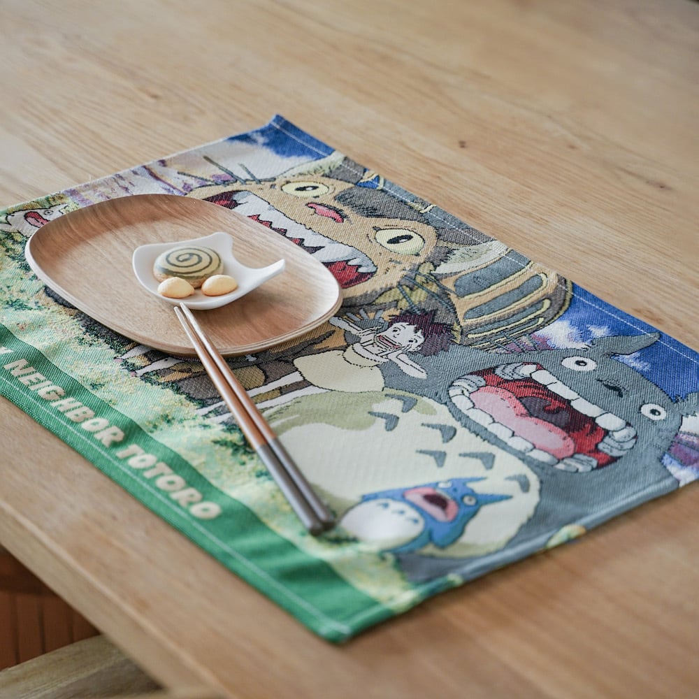 My neighbour totoro placement on the table with a wooden plate and a ceramic source plate and chopsticks