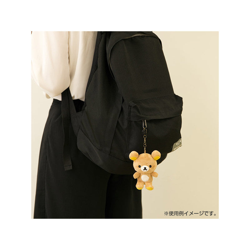 San-X Rilakkuma KeyChain Plushie attached to a black bag, demonstrating its practical use as a cute accessory