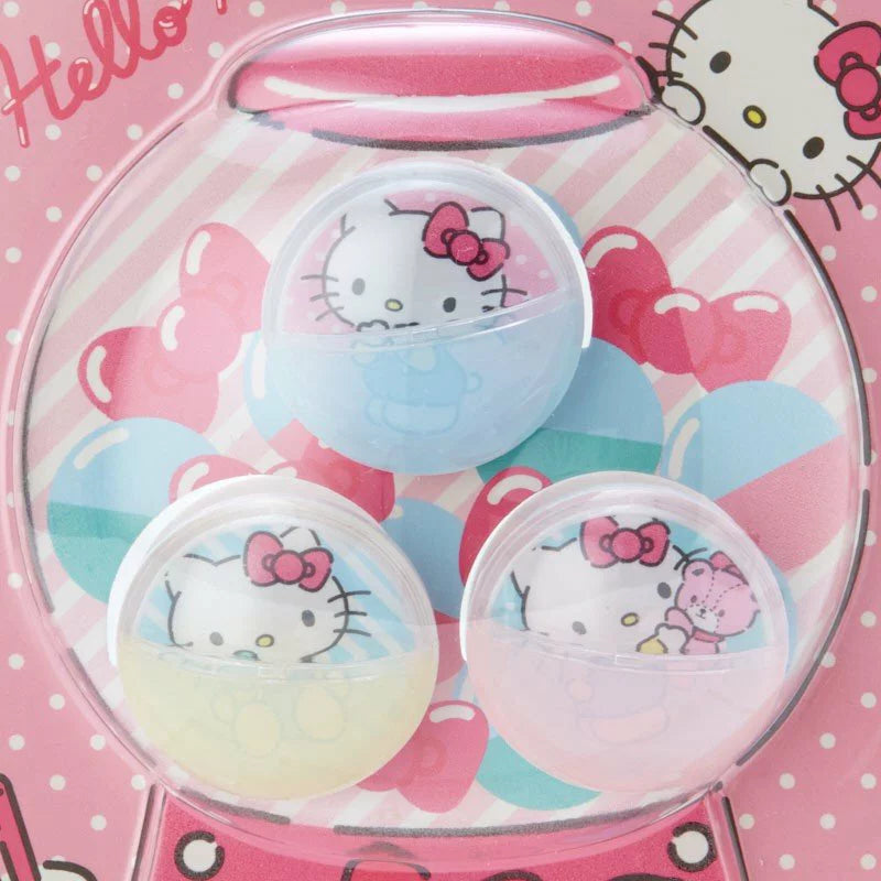 A close up view of Sanrio Hello Kitty Gashapon set featuring shell-shaped plastic clips with a pearlescent finish, showcasing the iconic Hello Kitty design.