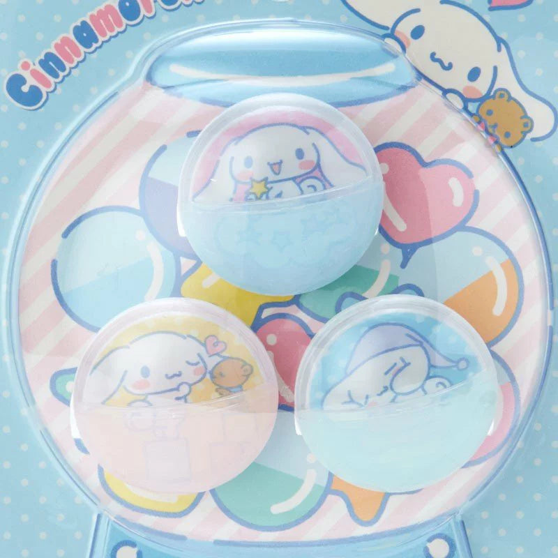 A close up view of Packaging of Sanrio Cinnamoroll Gashapon shell-shaped plastic clip set featuring cute Cinnamoroll characters and the phrase 'Long-eared wonder pup'