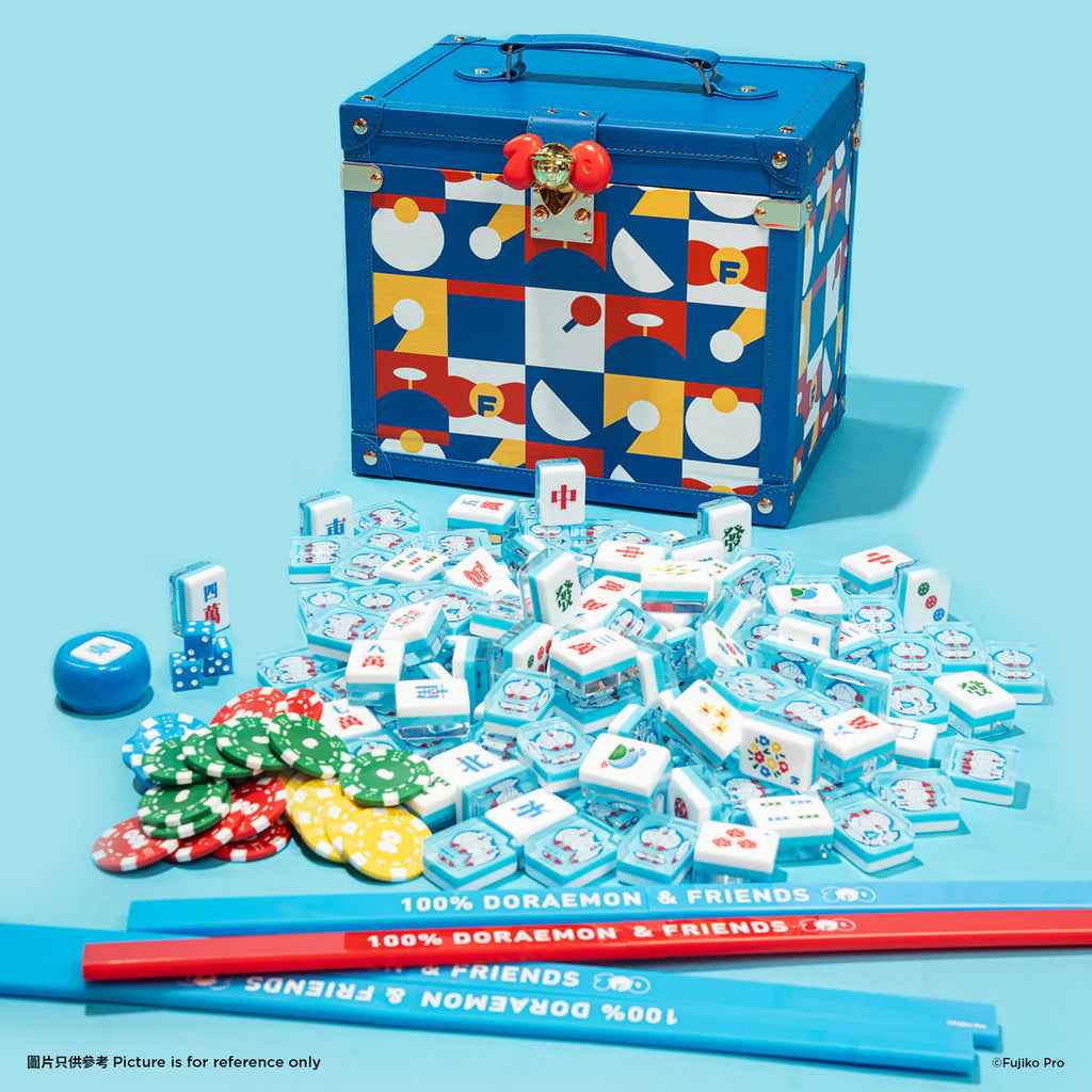 Doraemon and Friends Mahjong Set with tiles, chips, and accessories spread out in front of a colorful, geometric-patterned storage box.