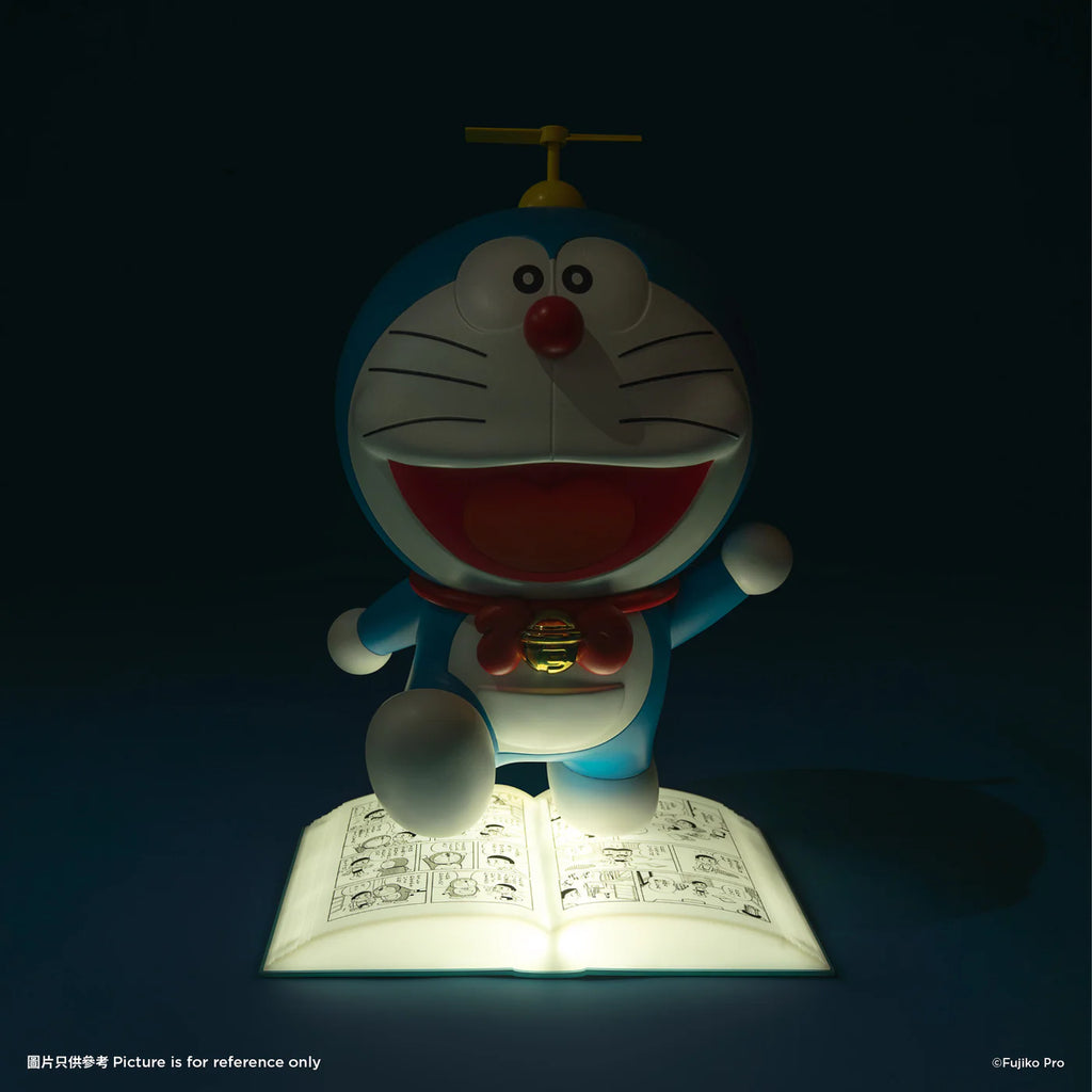 Doraemon night lamp glowing in the dark, illuminating the open comic book on which Doraemon stands, creating a warm and cozy atmosphere.