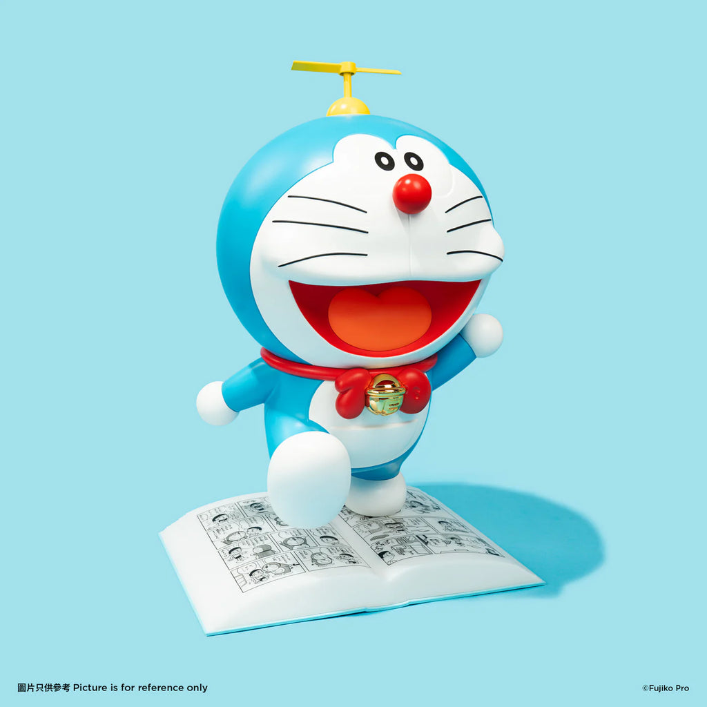 Side view of the Doraemon night lamp, showing the character joyfully standing on an open comic book with a yellow propeller on his head.