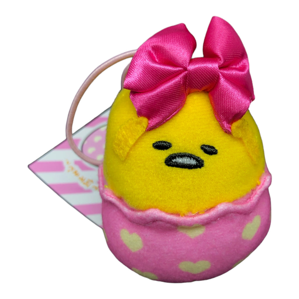 Vibrant yellow Sanrio Gudetama Mascot Hair Band with a pink satin bow on top and plush design