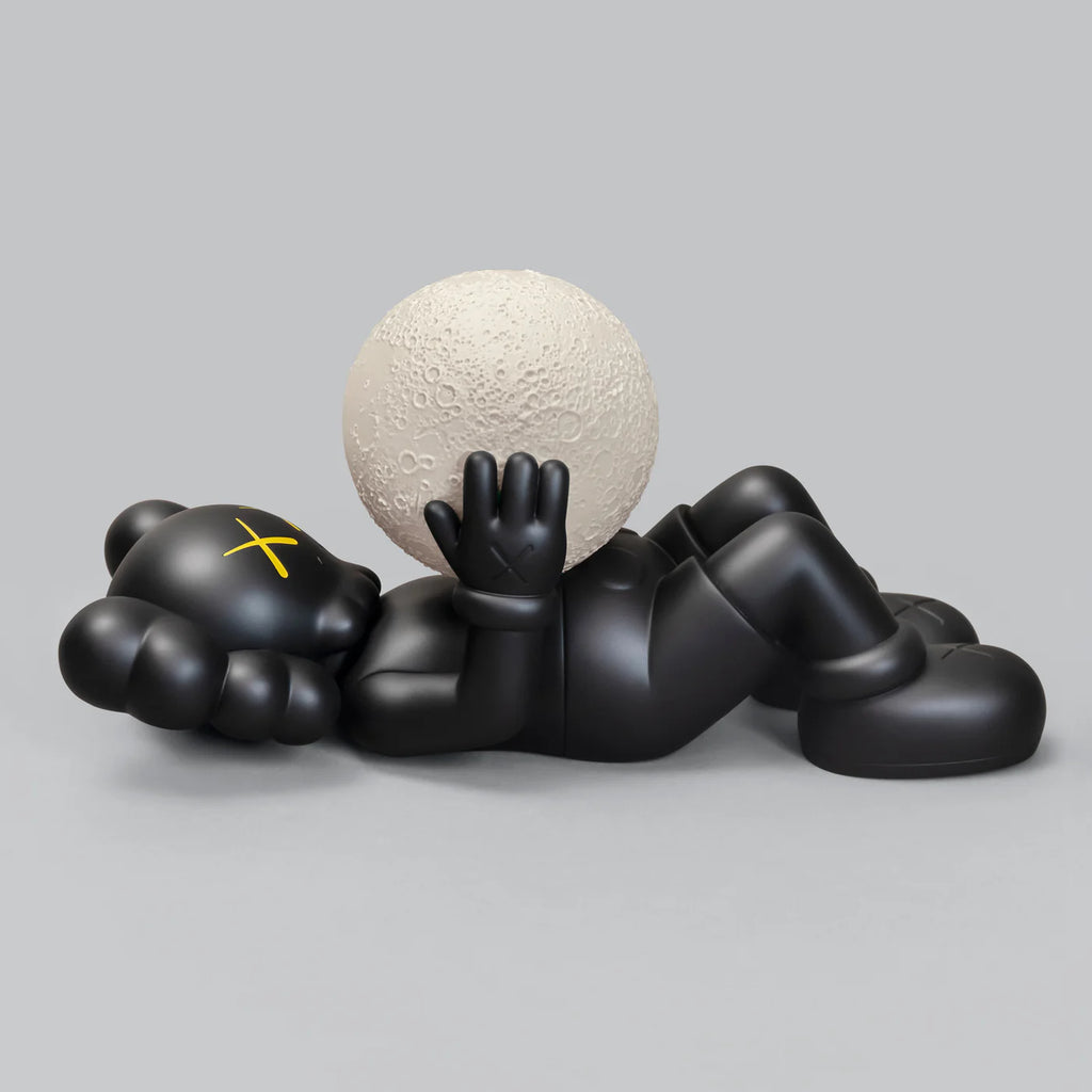 KAWS SHANGHAI Black Figure lying down while holding a moon.