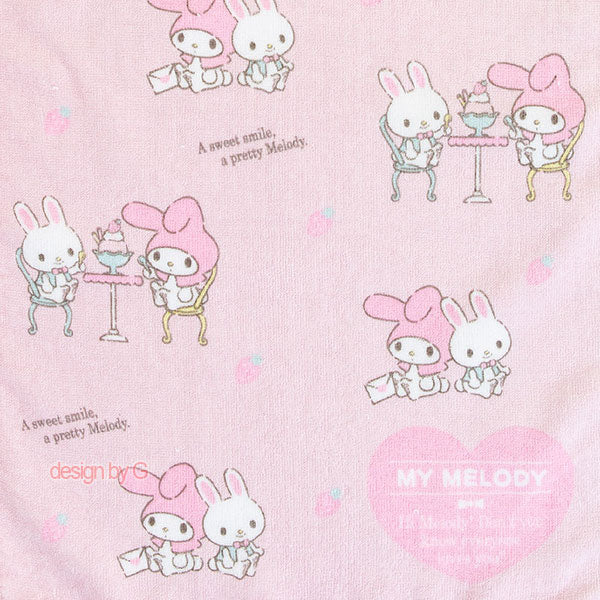 Close-up of Sanrio My Melody Long Towel showing detailed illustrations of characters having tea and dessert, in soft pink with heart accents.