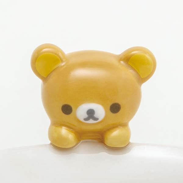 Close-up of the 3D Rilakkuma mascot figure attached to the rim of the San-X Chawan Bowl.