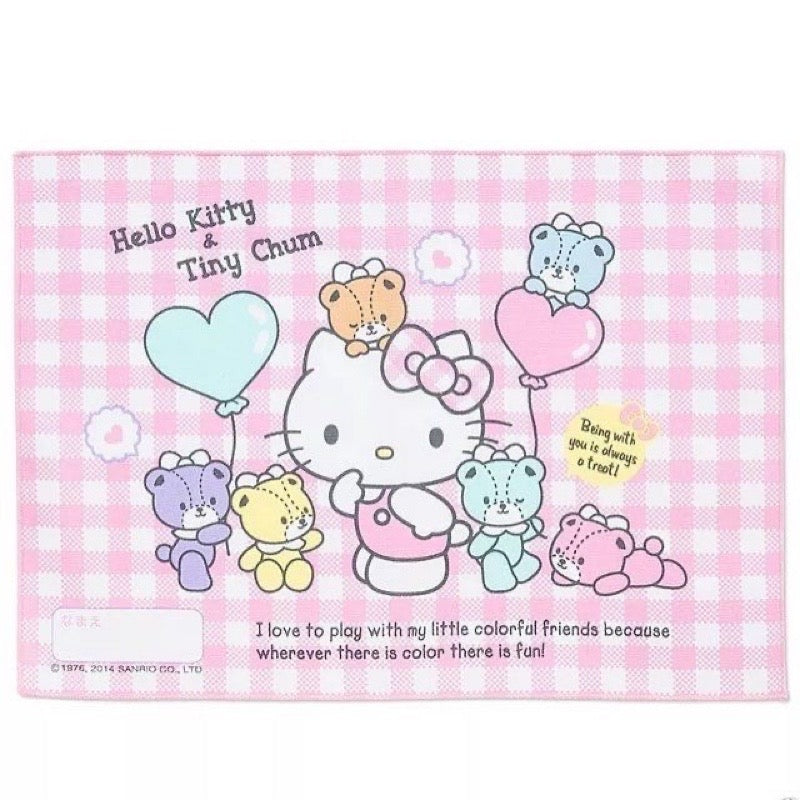 Front view of a Sanrio Hello Kitty portable lunch placemat in pink cotton, featuring Hello Kitty and Tiny Chum with heart balloons on a gingham background