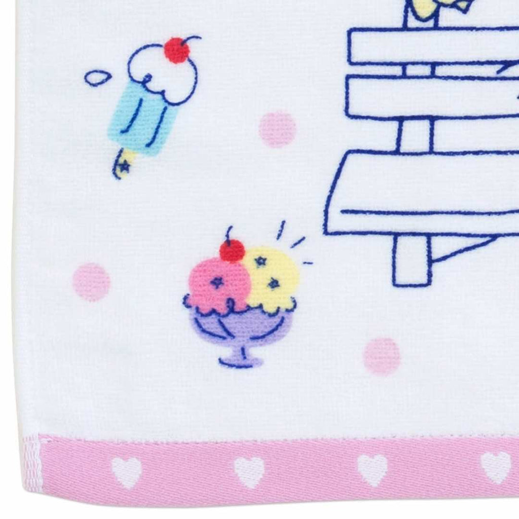 Sanrio Hello Kitty 'Give Me a Smile' facial towel – white towel with Hello Kitty's face and the words 'Give Me a Smile' printed in blue showcasing the yummy ice cream