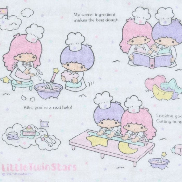 Close-up of Sanrio Little Twin Stars towel with Kiki and Lala mixing ingredients for a cake.