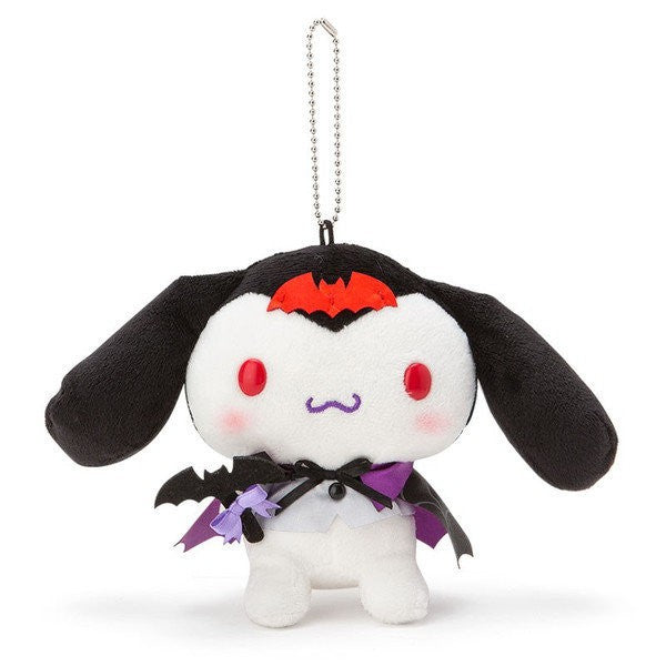 Front view of Sanrio Cinnamoroll Halloween Key Chain Plush, dressed in Dracula costume with red bat on its head.