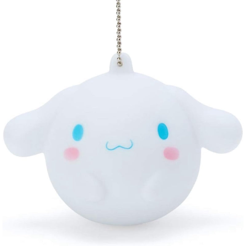 Close-up detail of the Cinnamoroll silicone keychain featuring its adorable big-face design and sound feature.