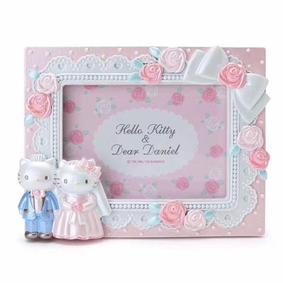 Hello Kitty and Dear Daniel wedding-themed photo frame featuring pink roses, pearls, and a romantic design with Hello Kitty and Daniel dressed in bridal attire.