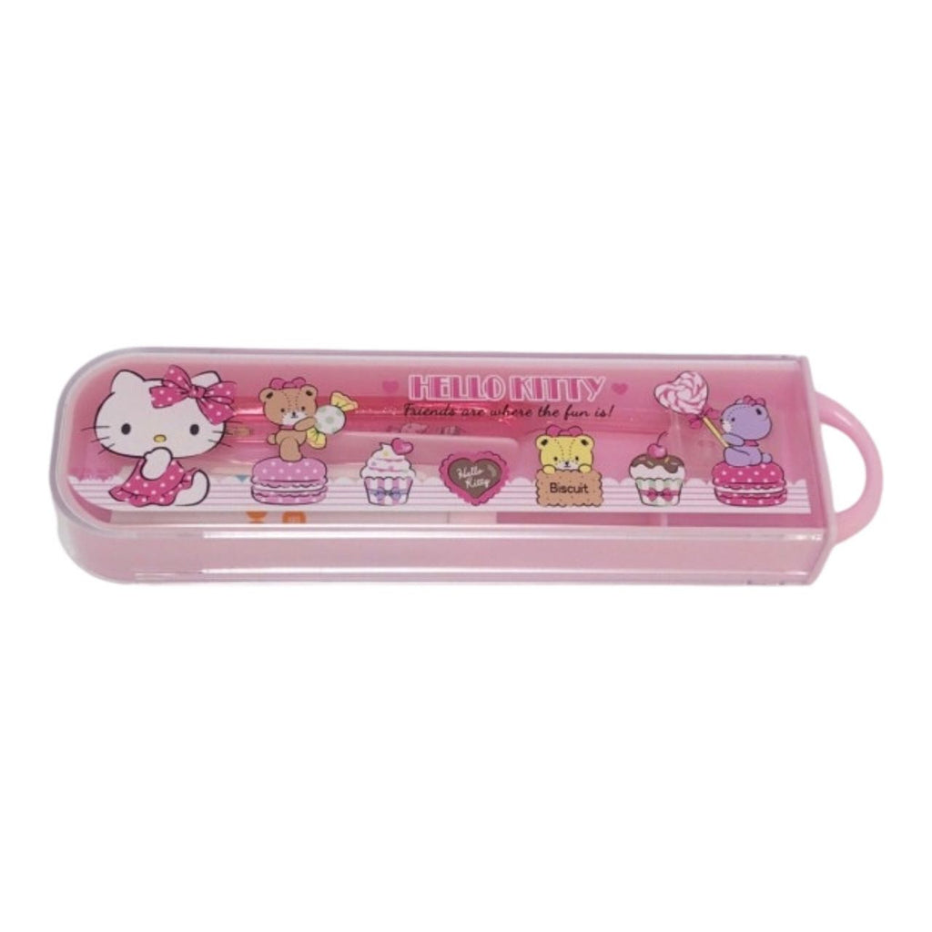 Hello Kitty travel toothbrush set with pink case decorated with cupcakes and characters.