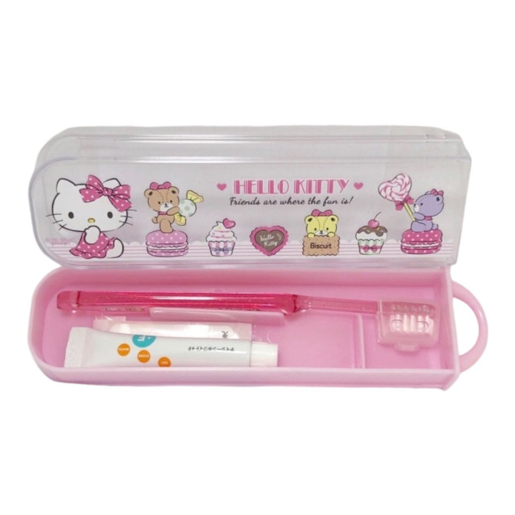 Opened Hello Kitty travel toothbrush case with toothbrush, toothpaste, and cap inside.