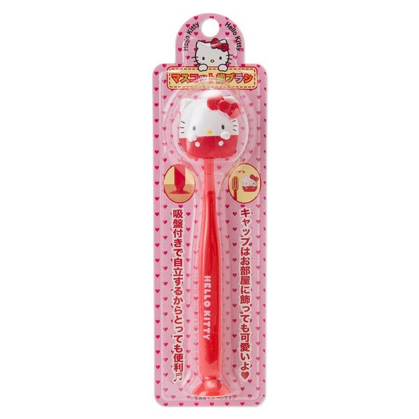 Hello Kitty toothbrush in original pink packaging with heart design.