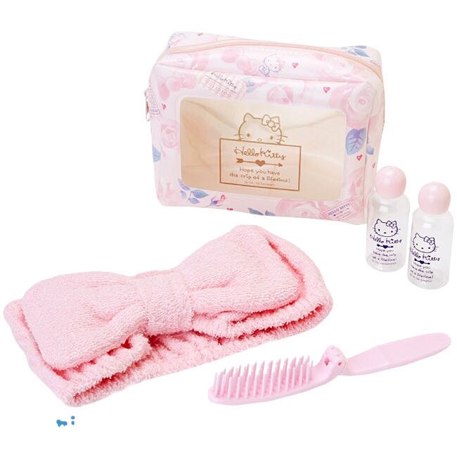 Hello Kitty Girly Travel Series Toiletry Set in a pink floral pouch with headband, comb, and travel containers.