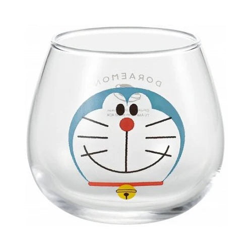 Clear glass cup with a printed Doraemon face design
