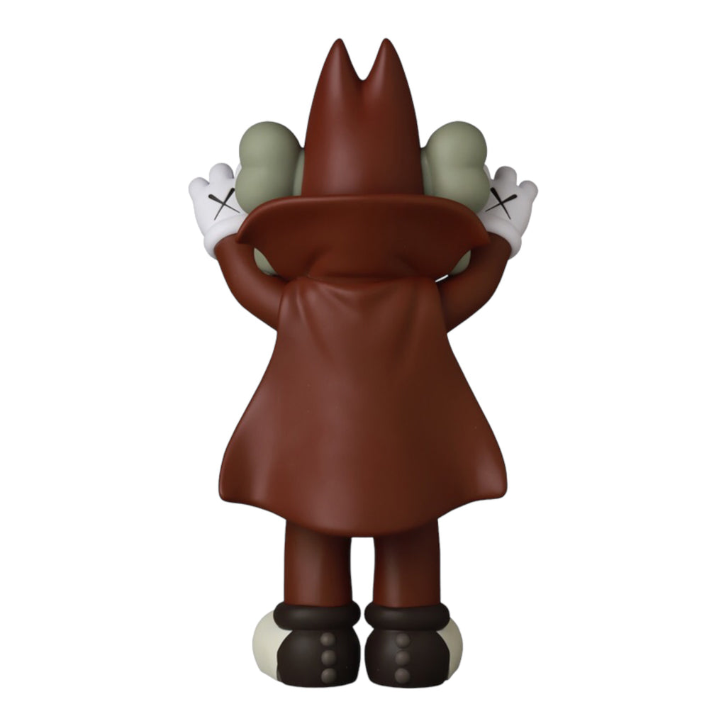 Rear view of the artistic chocolate-themed figure, highlighting its cape-like coat and contrasting white gloves with the trademark crossed-out eyes on the back of its head