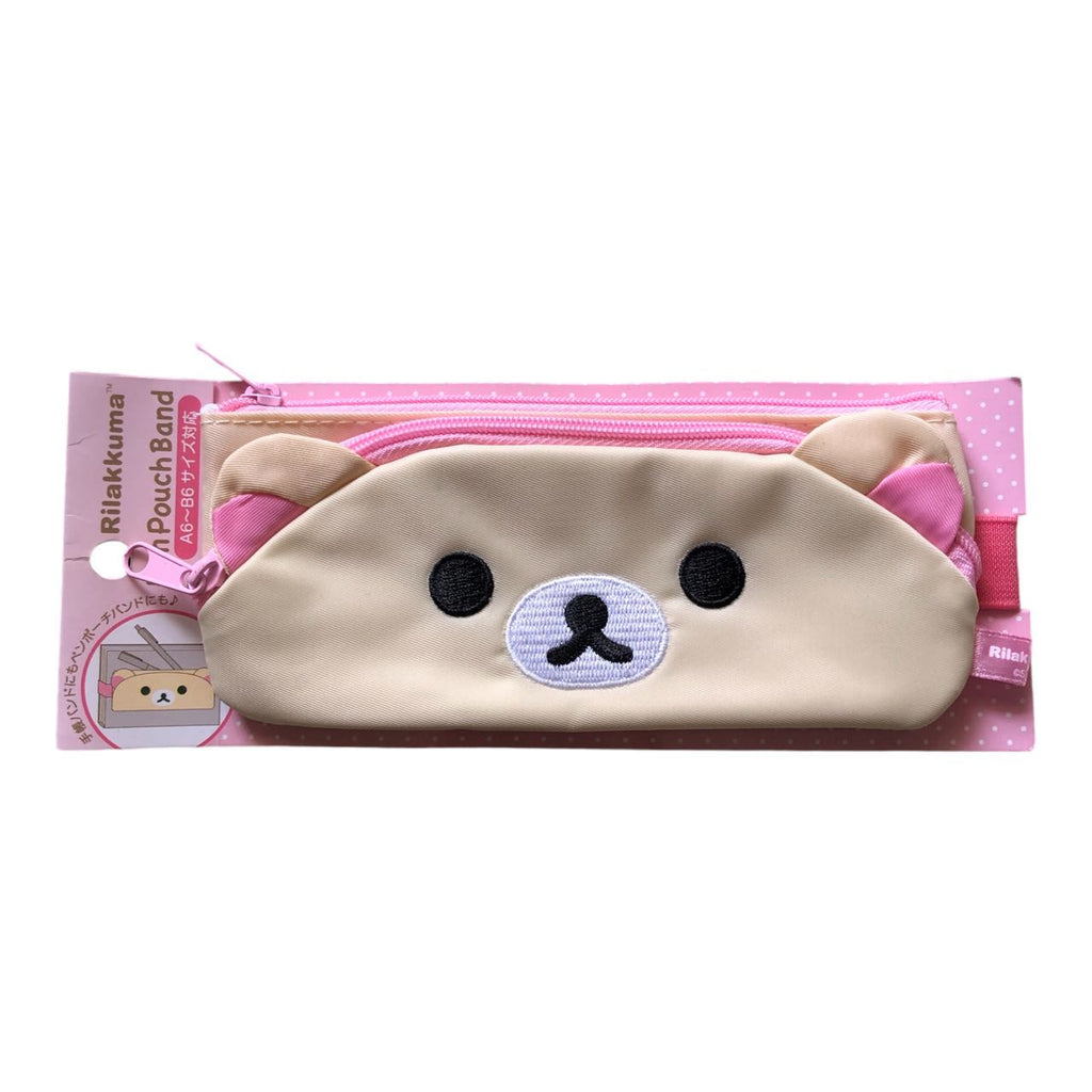 Korilakkuma pink pouch band with embroidered bear face for storing essentials.