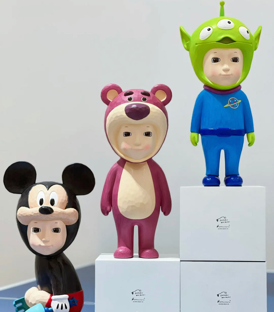lotso resin sculputre by Satoru Koizumi surrounded with Mickey Mouse and Alien sculptures