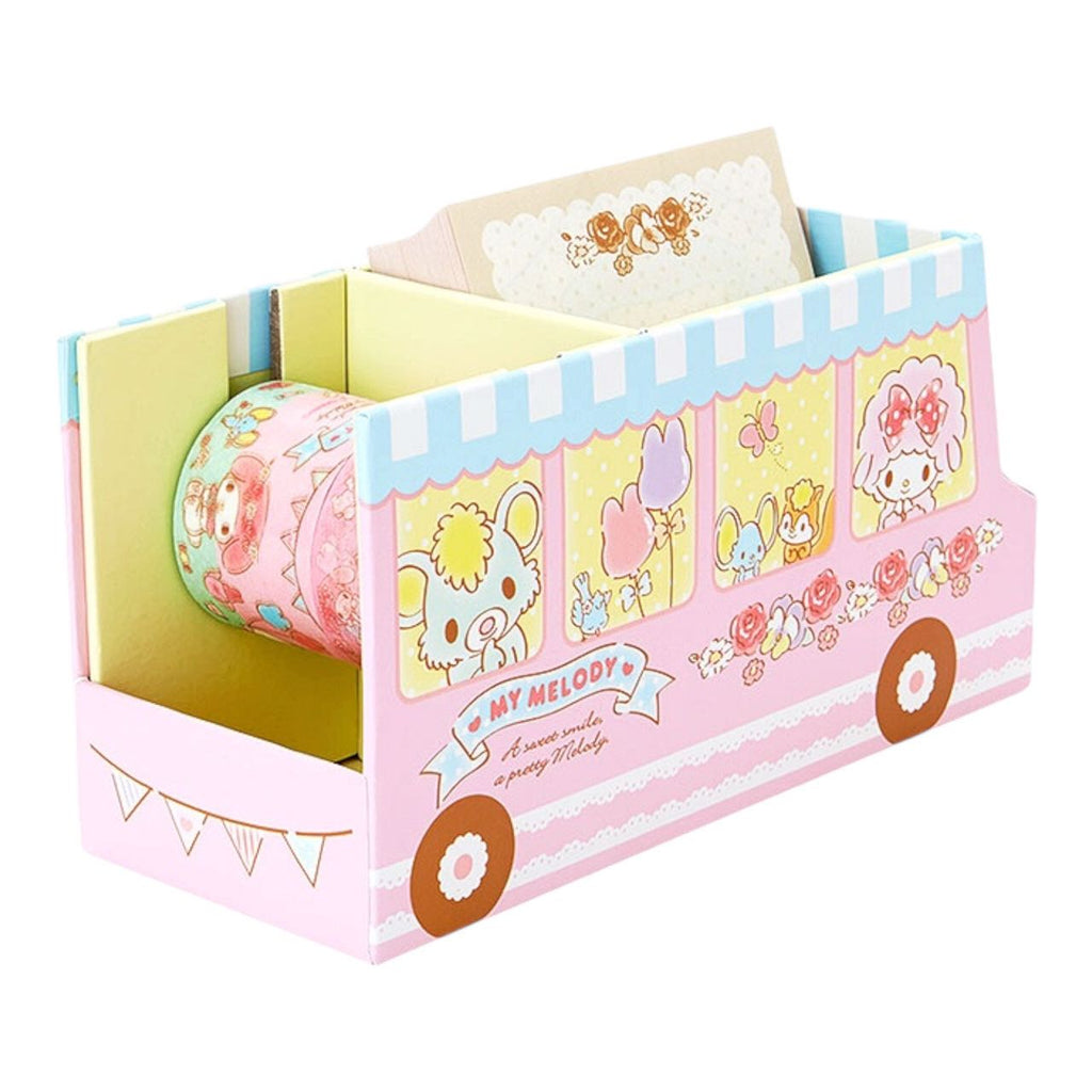 Back view of My Melody bus-shaped dispenser holding deco tape and memo pads.