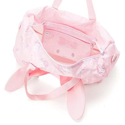 Interior of My Melody travel bag with view of internal pouch attached inside.