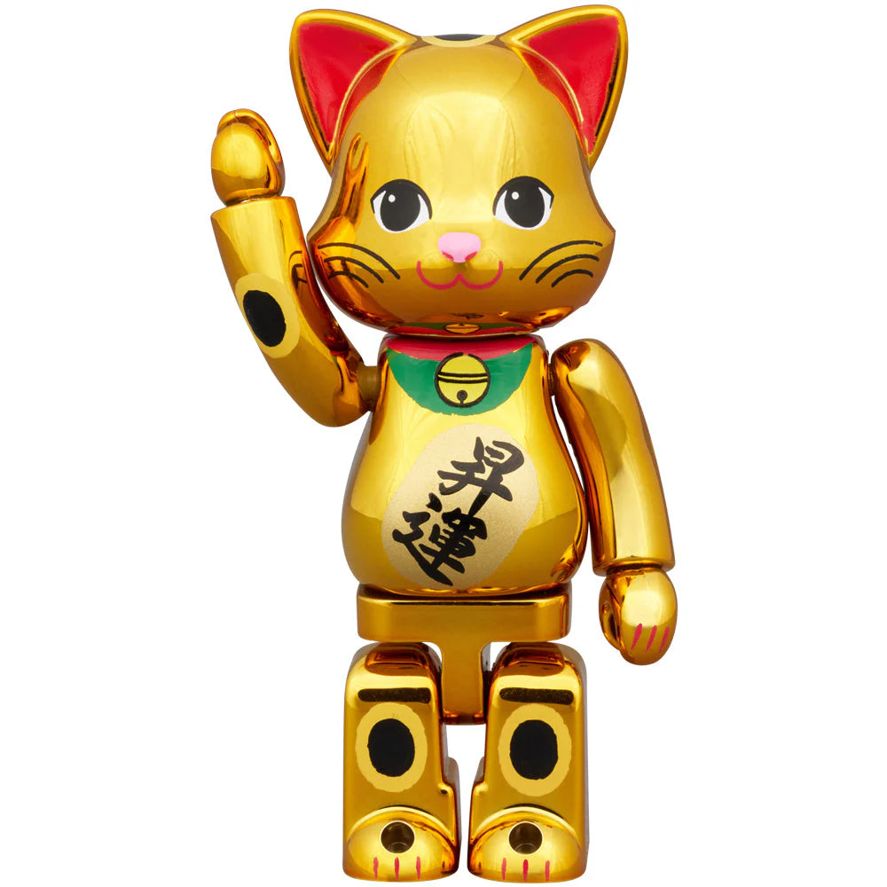 Close-up of the 100% NY@BRICK Manekineko gold figure with kanji on the belly.