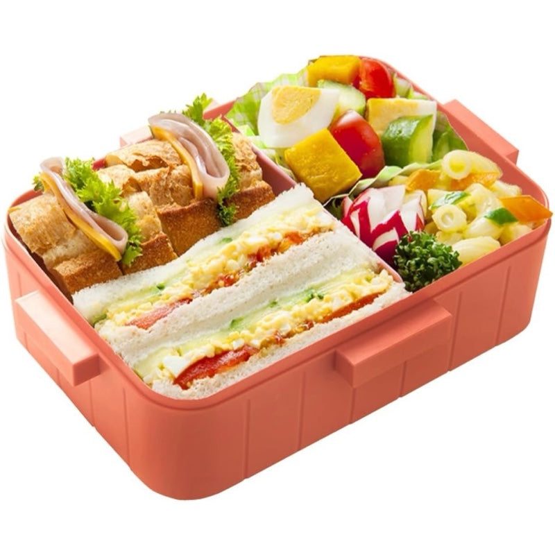 Pikachu bento box packed with a balanced meal of sandwiches and fresh veggies.

