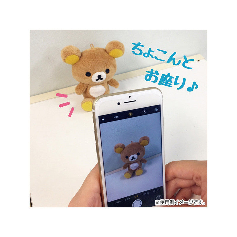 San-X Rilakkuma KeyChain Plushie being photographed with a smartphone, illustrating its photogenic and collectible nature.