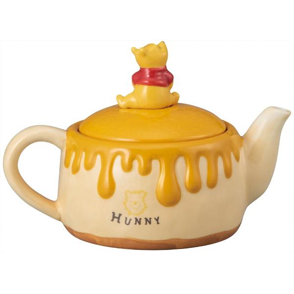 winnie the pooh teapot with winnie sitting on top of the lid and the honey leaking visualisation