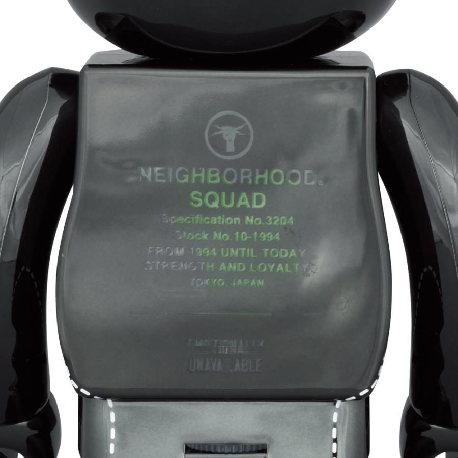 Close-up of the back of a Bearbrick figurine displaying embossed text and logos for 'NEIGHBORHOOD. SQUAD' with details like 'Specification No.3204', 'Stock No.10-1994', and 'From 1994 Until Today. Strength and Loyalty. Tokyo, Japan'. Also features the word 'UNAVAILABLE' at the bottom