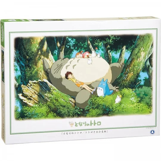 Box of My Neighbor Totoro 1000-piece jigsaw puzzle depicting Totoro, Satsuki, and Mei napping peacefully in a lush forest with smaller forest spirits.