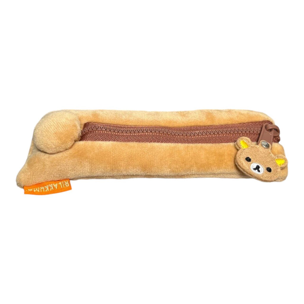 Front view of the Rilakkuma plush pencil case with soft fabric and cute zipper charm.