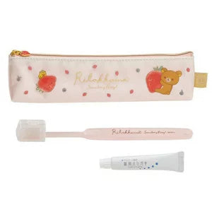 Rilakkuma toothbrush and case with cute strawberry and bear designs.