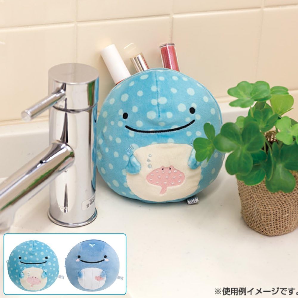 San-X Jinbesan plush coin purse displayed on a sink, holding small items like cosmetics, with cute and soft plush design