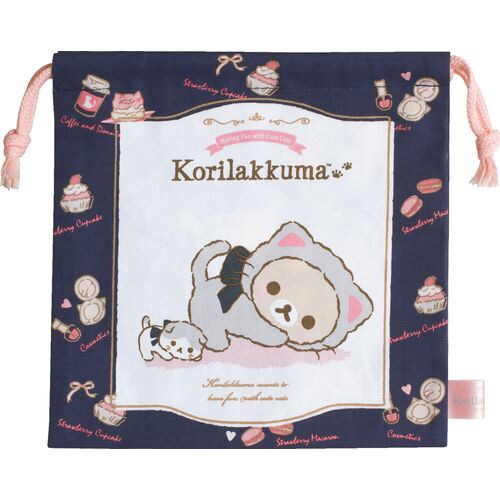 Front side of Korilakkuma Cat navy drawstring bag by San-X, featuring a cute cat theme and dessert accents.