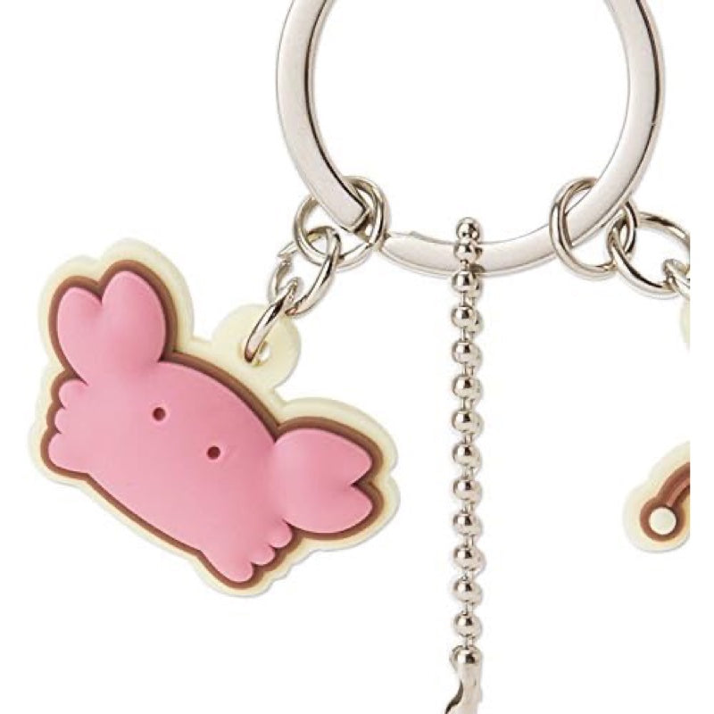 Pink crab charm on the Sanrio Marumofubiyori key chain with vibrant details.